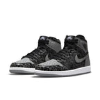 Jordan 1 Retro High OG Rebellionaire sneakers featuring black and gray premium upper with unique graphic design.
