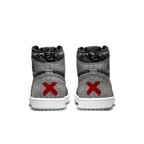 Jordan 1 Retro High OG Rebellionaire sneaker with gray upper and red accents on the heel.