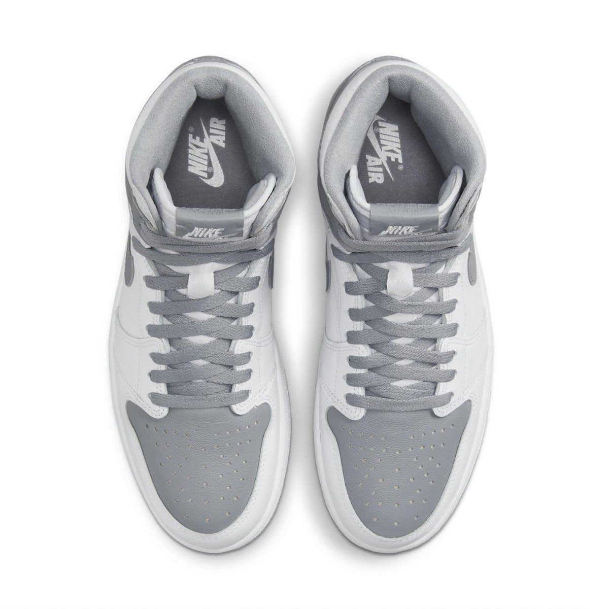 Nike Air Jordan 1 Retro High OG Stealth sneakers in white and Stealth Grey, top view showcasing smooth leather and suede details.