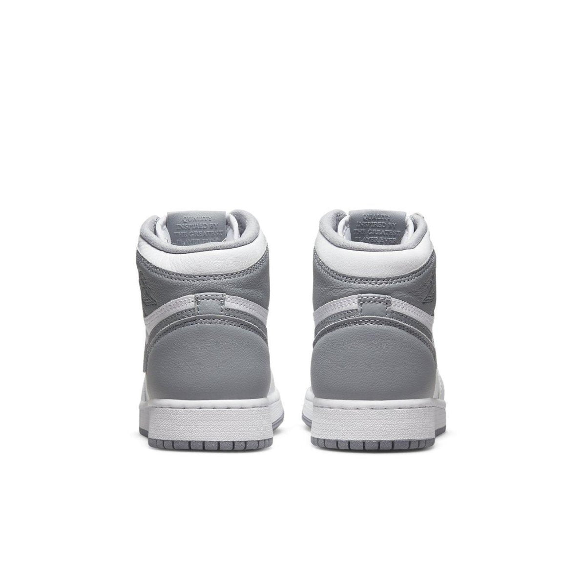 Rear view of Air Jordan 1 Retro High OG Stealth (GS) sneakers showcasing grey and white design.