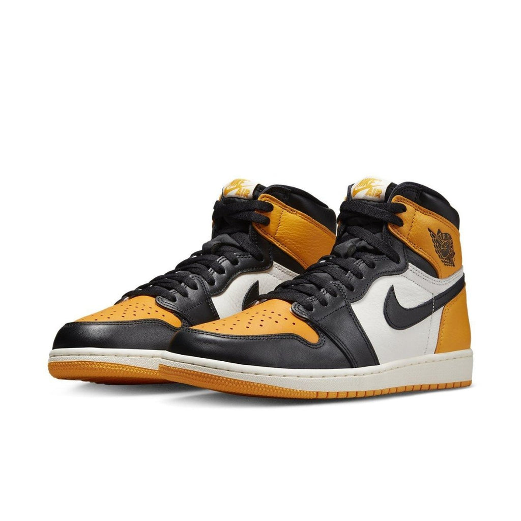 Air Jordan 1 Retro High OG Taxi featuring yellow toe, black accents, and iconic white leather panel.