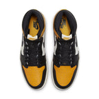 Air Jordan 1 Retro High OG Taxi top view showcasing yellow toe, black and white leather upper.