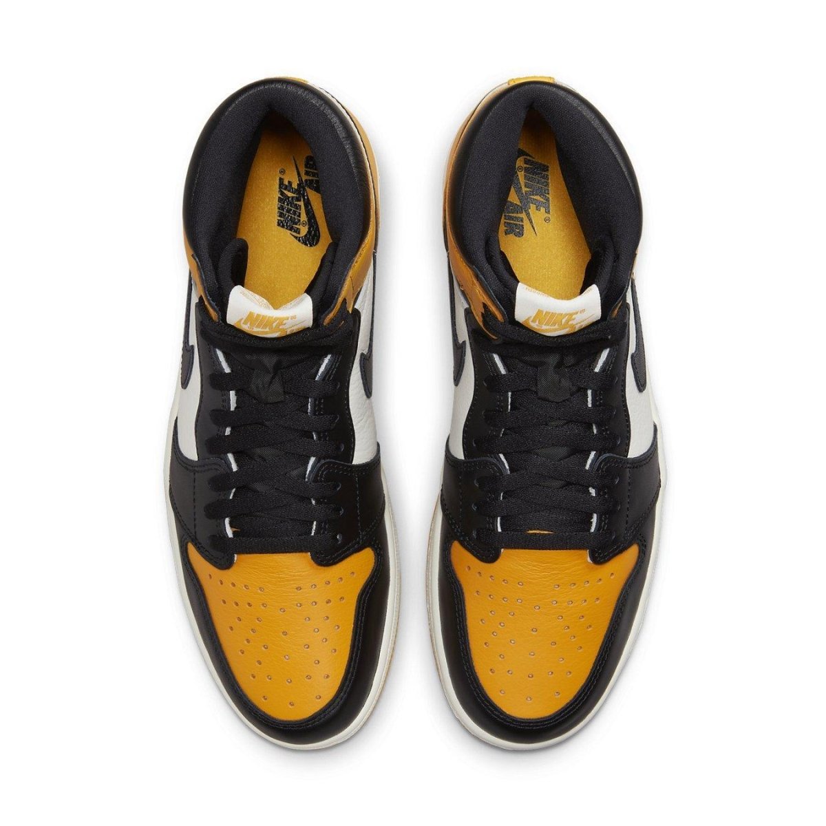 Air Jordan 1 Retro High OG Taxi top view showcasing yellow toe, black and white leather upper.