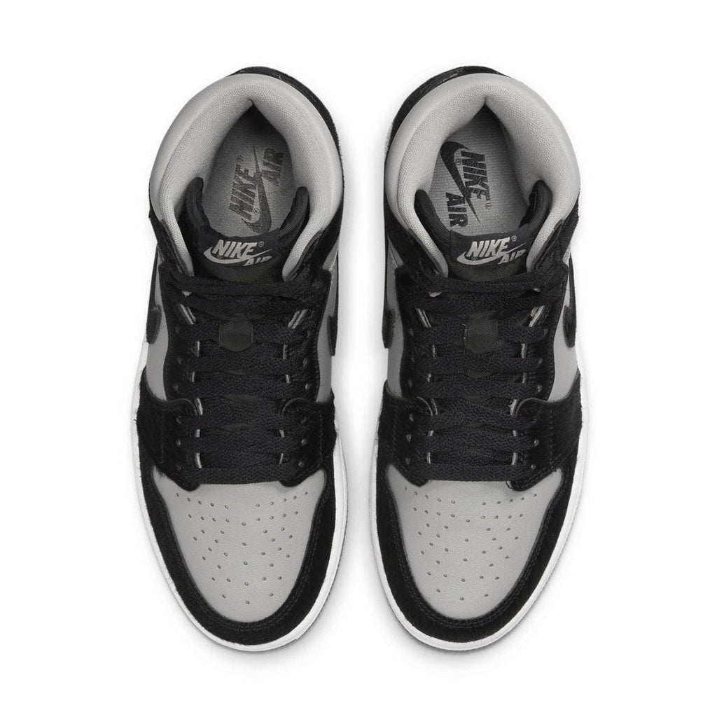 Air Jordan 1 Retro High OG Twist 2.0 Medium Grey top view showcasing grey and black colorway with Nike branding.