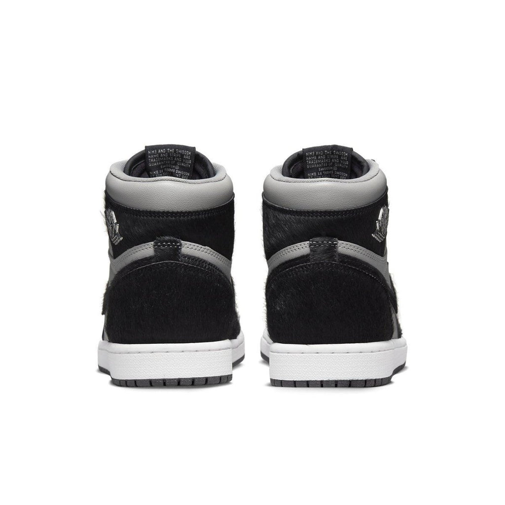Back view of the Jordan 1 Retro High OG Twist 2.0 in medium grey with pony hair detailing and white sole.