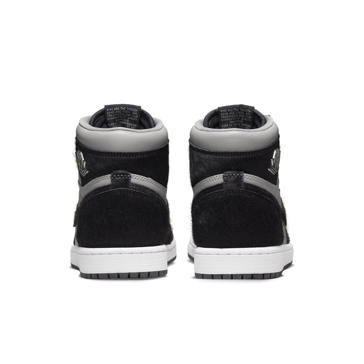 Back view of the Jordan 1 Retro High OG Twist 2.0 in medium grey with pony hair detailing and white sole.