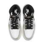 Air Jordan 1 Retro High OG White Cement top view showcasing elephant print and black laces.