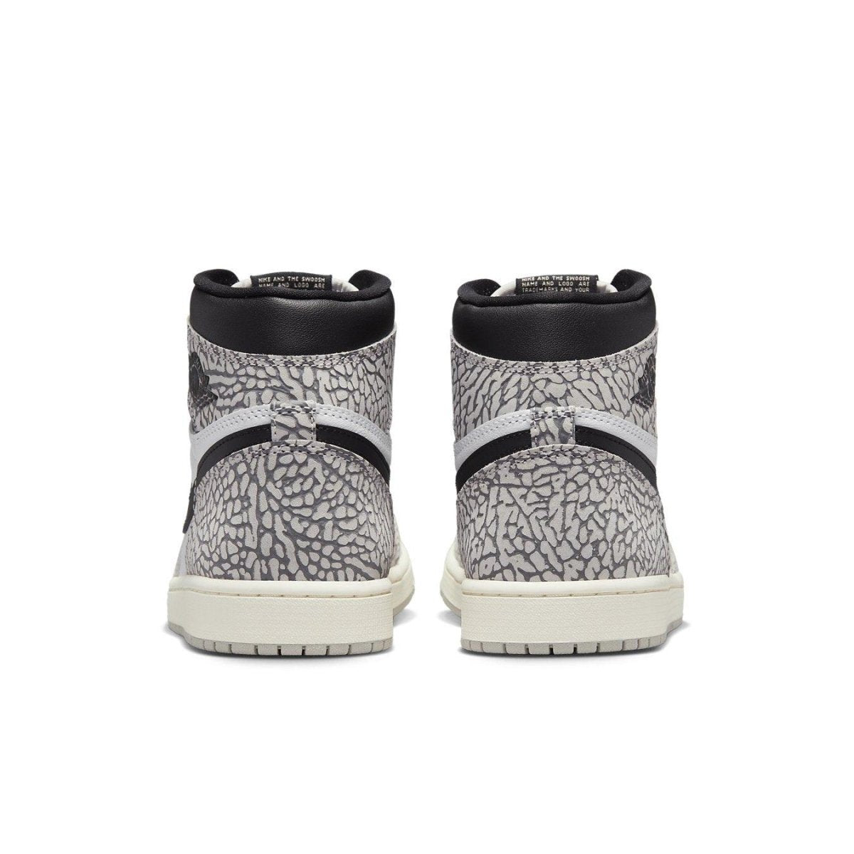 Air Jordan 1 Retro High OG White Cement rear view showcasing unique elephant print and black leather accents.