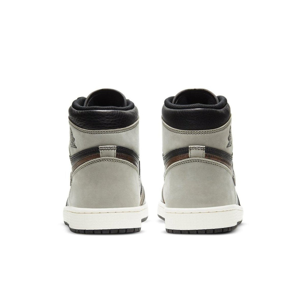 Rear view of Air Jordan 1 Retro High Patina featuring a vintage aesthetic with black and gray leather design.