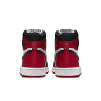 Back view of Air Jordan 1 Retro High Satin Black Toe women's sneakers featuring red satin panels.