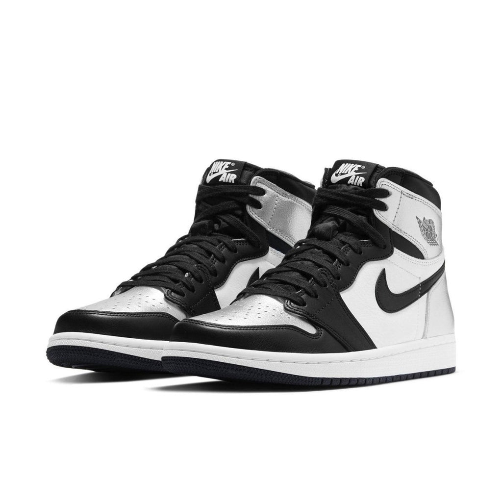 Jordan 1 Retro High Silver Toe (W) featuring black, silver, and white colorway for a stylish sneaker look.
