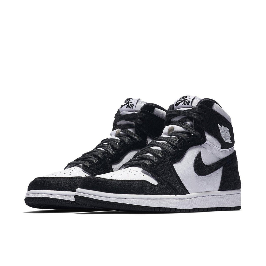 Nike Air Jordan 1 Retro High Twist Womens sneakers in black and white with suede and leather design.