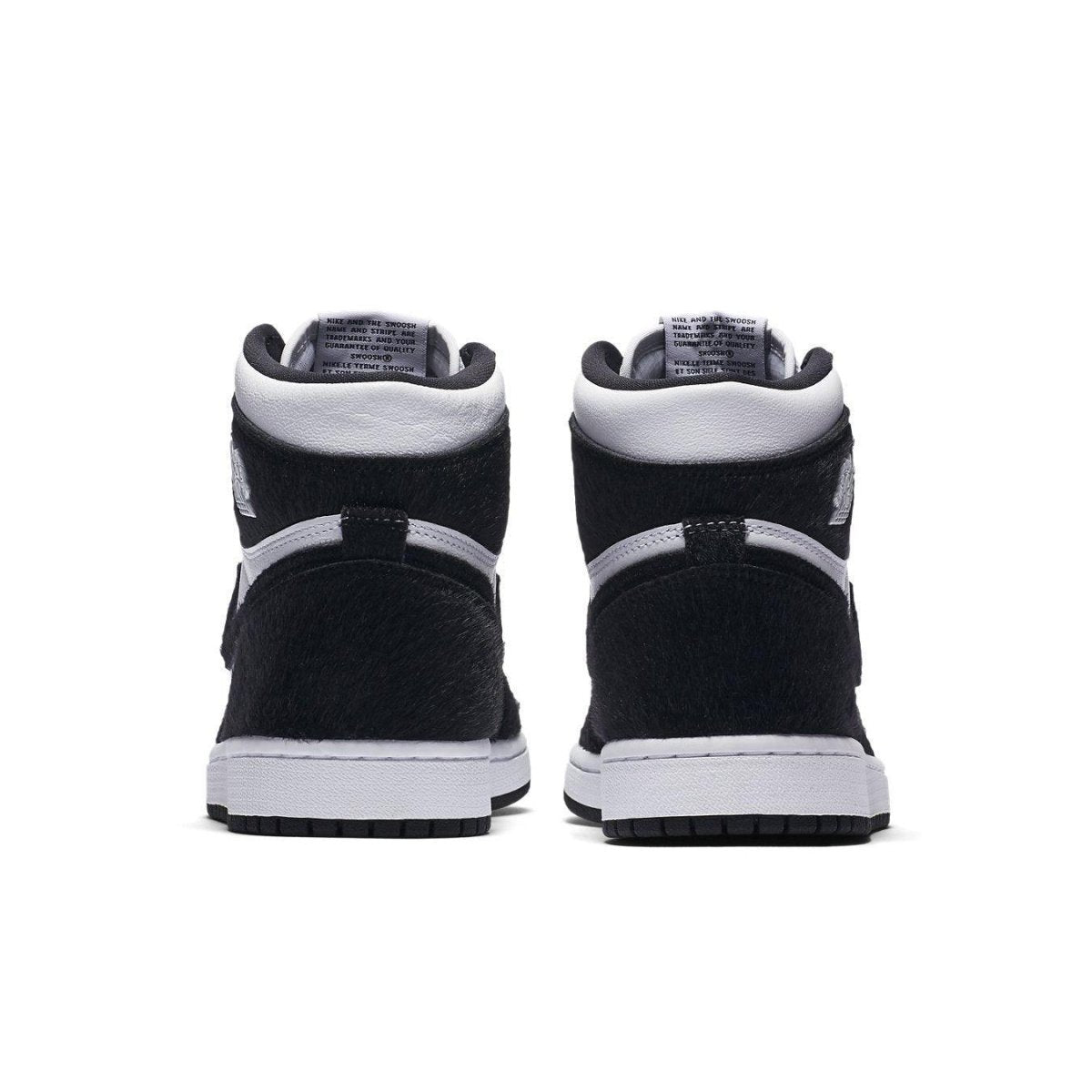 Rear view of the Jordan 1 Retro High Twist Women's sneakers in black and white with suede and synthetic fur details.