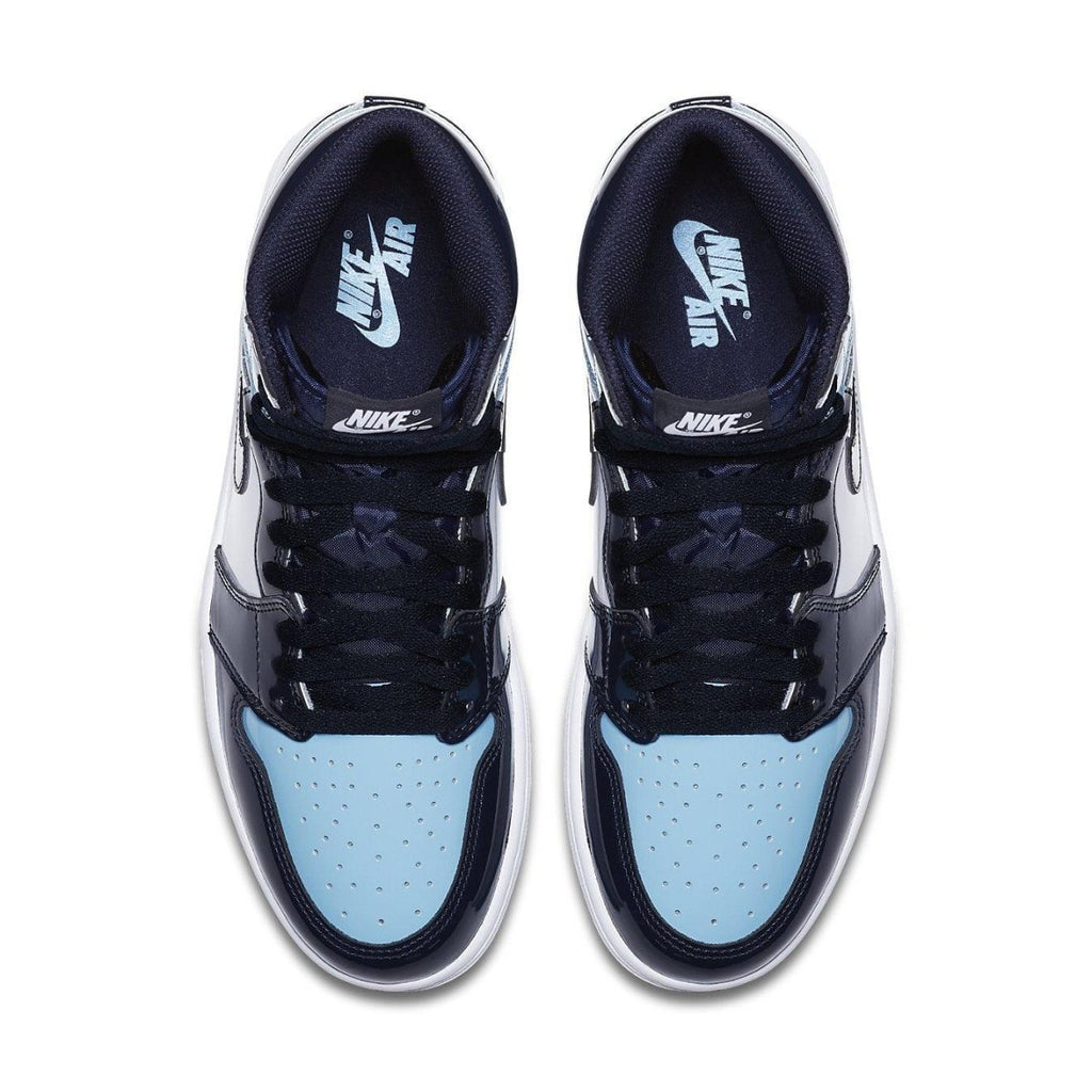Air Jordan 1 Retro High UNC Patent women's sneaker in Blue Chill and Obsidian colorway.