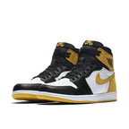 Air Jordan 1 Retro High OG Yellow Ochre sneakers in black, white, and yellow colorway, featuring iconic design details.