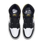 Top view of Jordan 1 Retro High Yellow Ochre sneakers featuring black and white design with yellow accents.