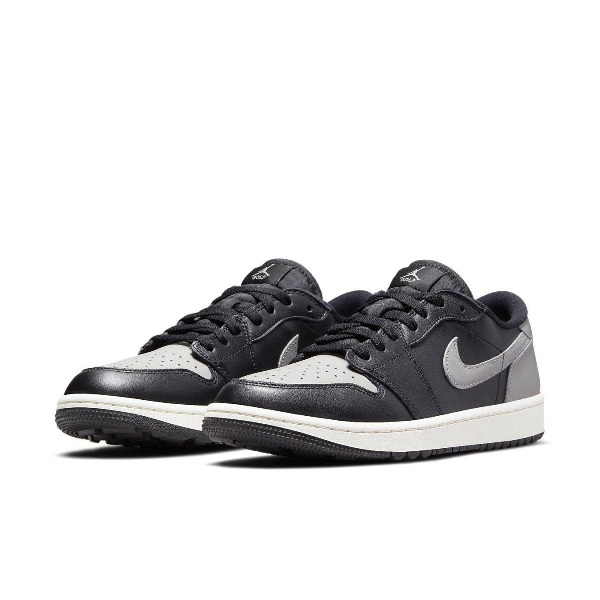 Jordan 1 Retro Low Golf Shadow sneakers in black and grey, featuring smooth leather upper and unique traction for grass.