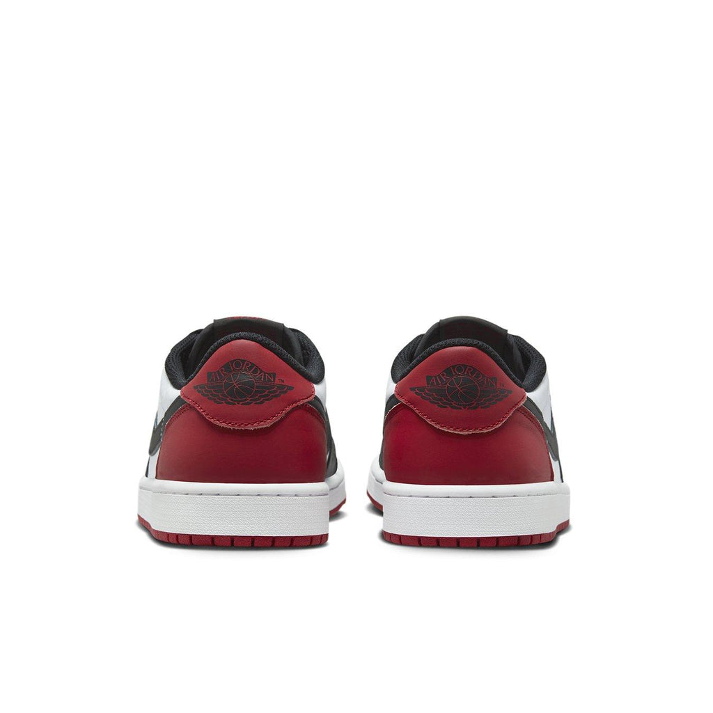 Rear view of Jordan 1 Retro Low OG Black Toe 2023 sneakers highlighting red and black colorway.