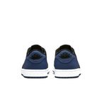 Rear view of Jordan 1 Retro Low OG Mystic Navy sneakers showcasing black and dark blue colorway.
