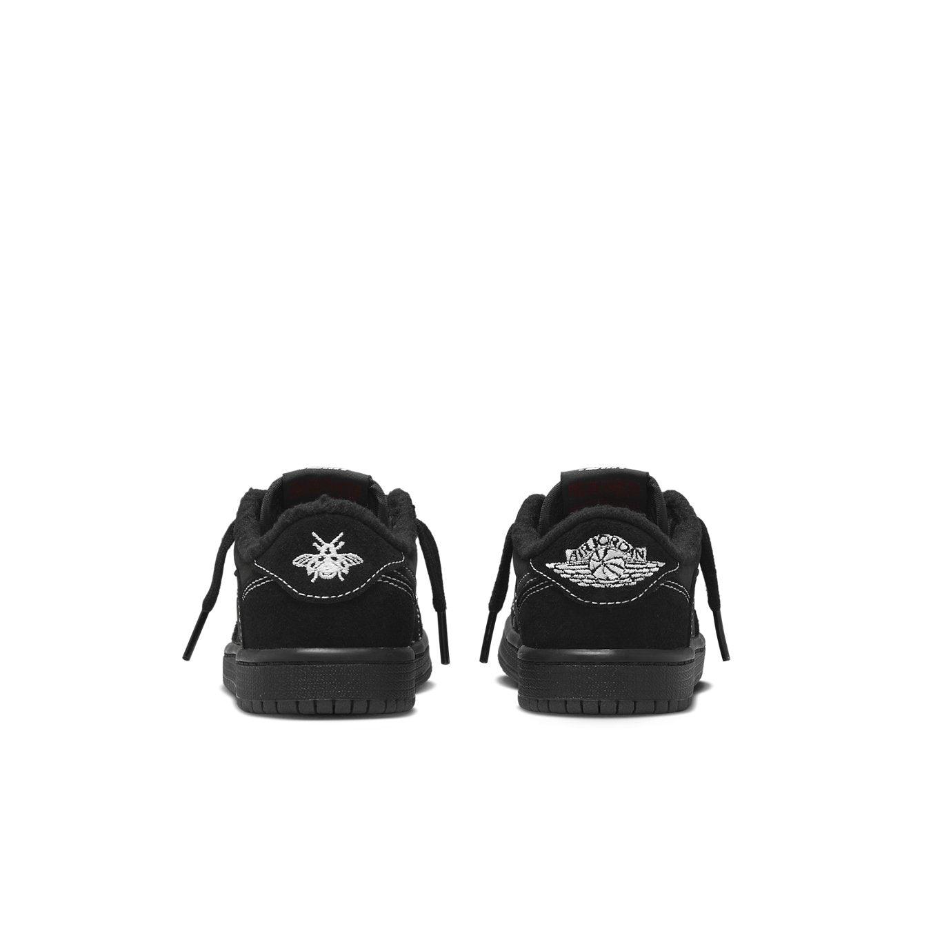 Back view of Jordan 1 Retro Low OG SP Travis Scott Black Phantom kids sneakers featuring sleek black suede and distinct logos.