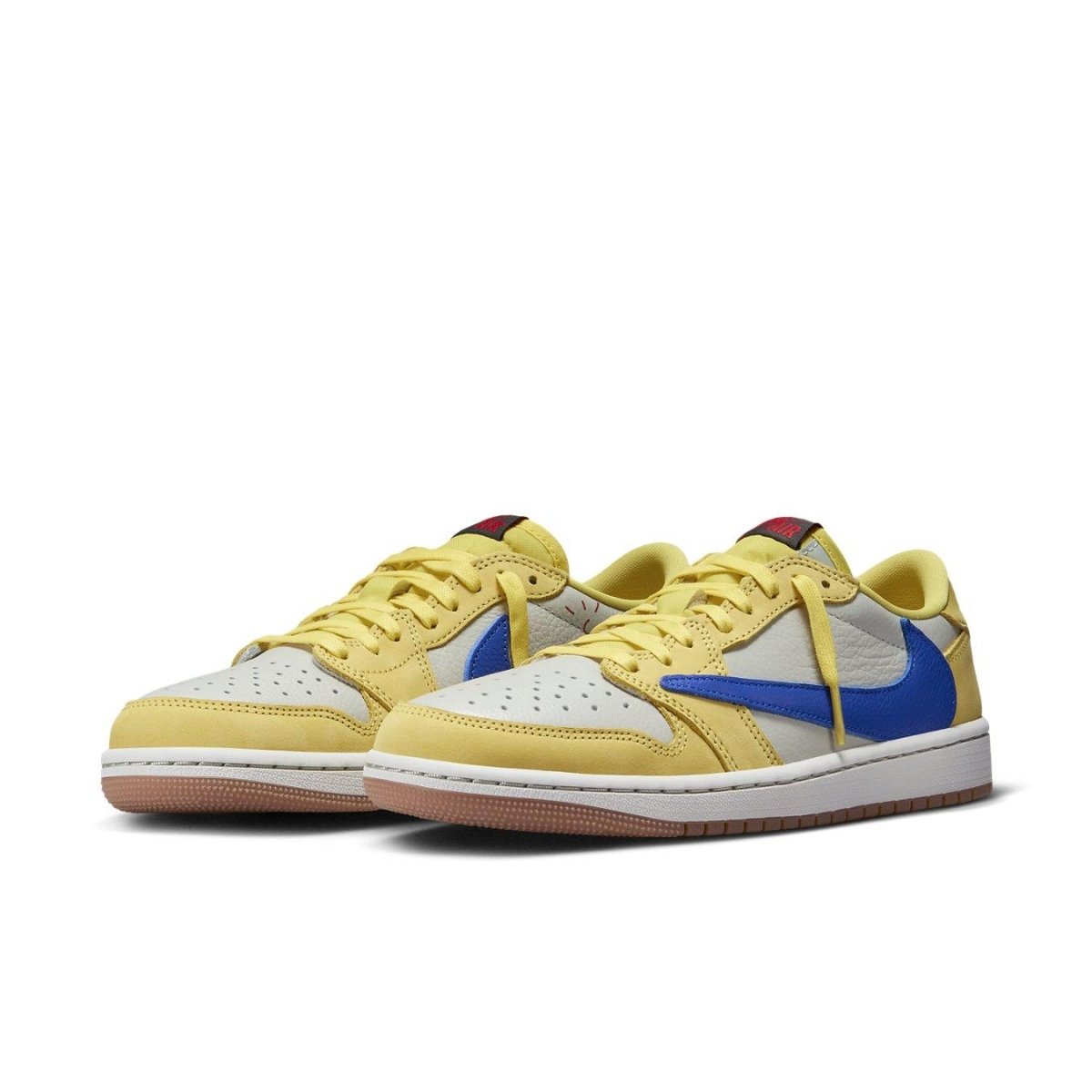 Jordan 1 Retro Low OG SP Travis Scott Canary sneakers in yellow and blue with white leather accents.