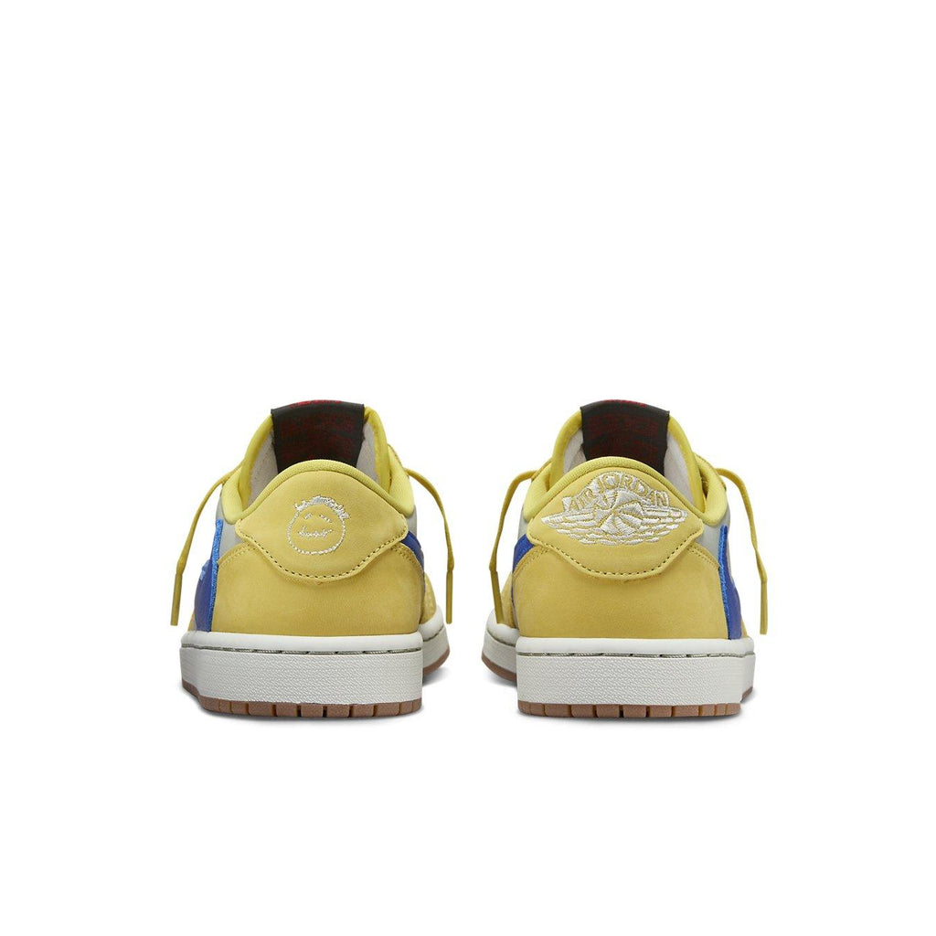 Rear view of Women's Air Jordan 1 Retro Low OG SP 'Travis Scott Canary' in yellow and blue, showcasing unique design.