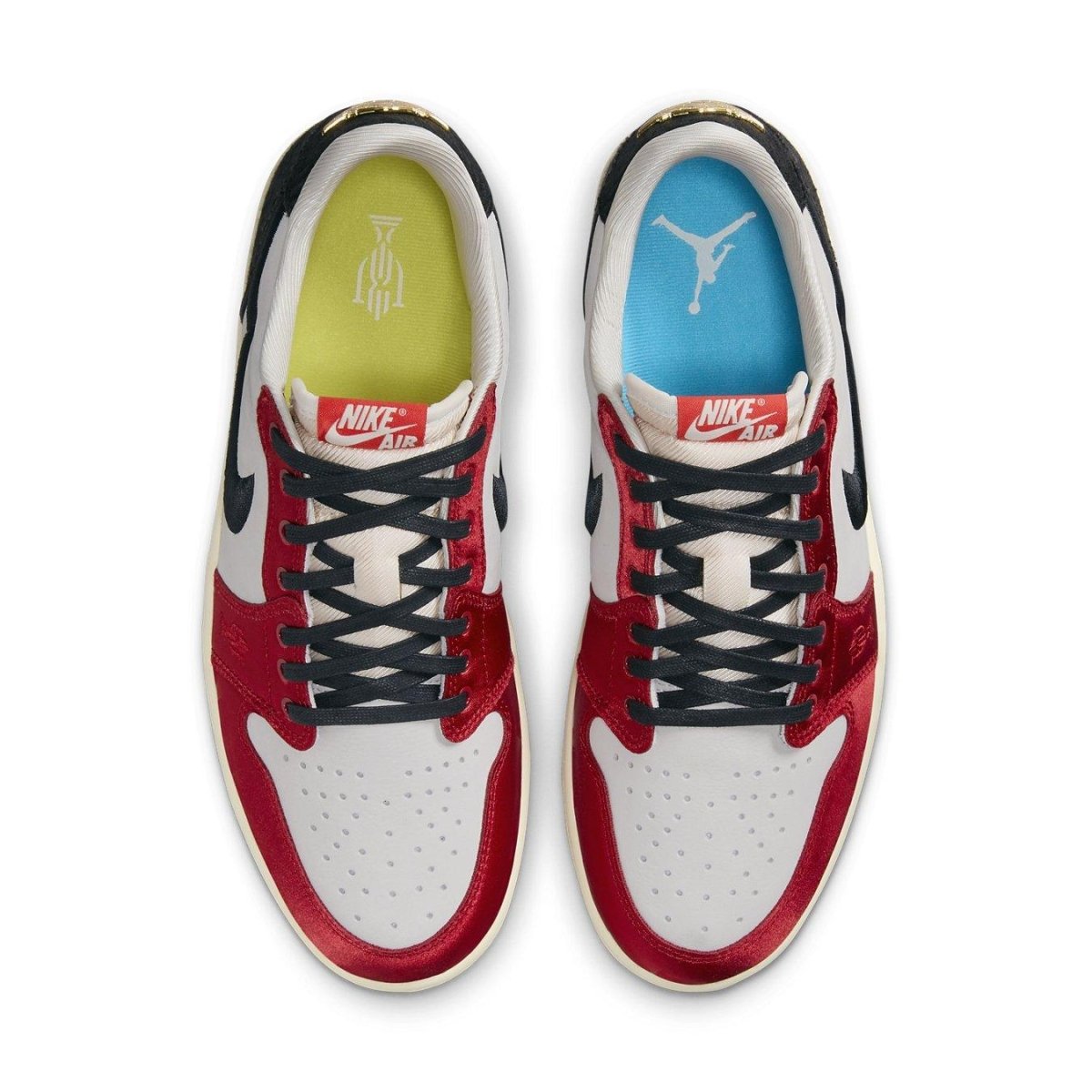 Top view of the Jordan 1 Retro Low OG Trophy Room Away featuring white leather, red satin overlays, and colorful insoles.