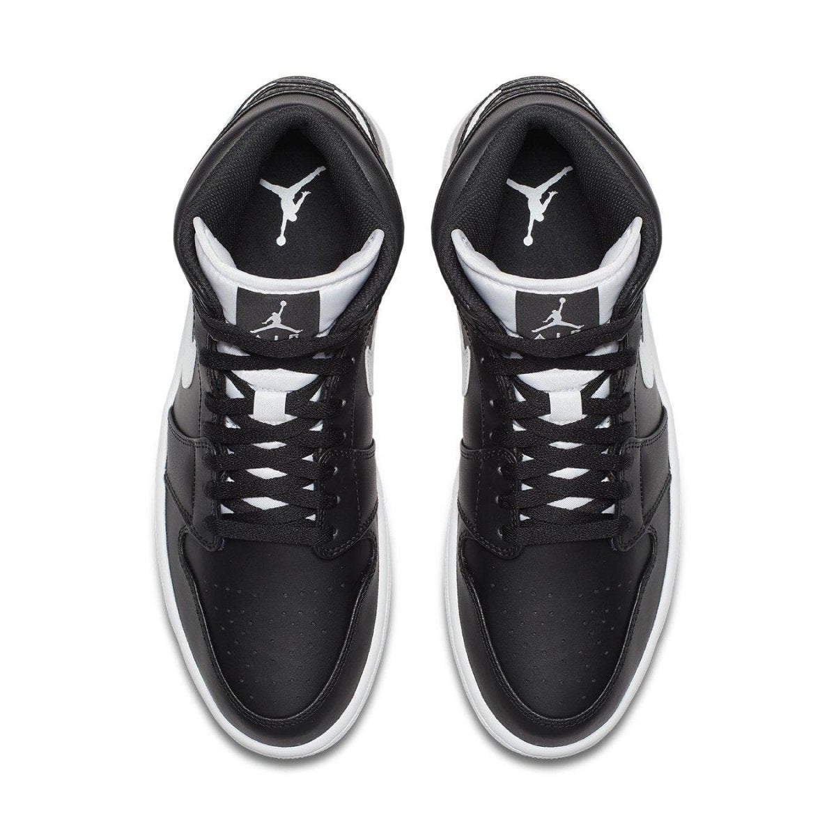 Top view of Air Jordan 1 Retro Mid Black White featuring black leather upper and white accents.