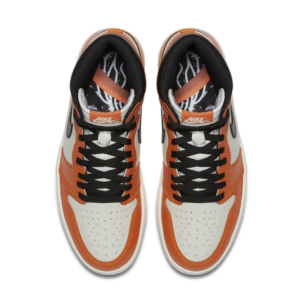 Air Jordan 1 Retro Reverse Shattered Backboard sneakers in orange, black, and white colorway from above.