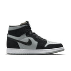 Jordan 1 Zoom CMFT Black Light Smoke Grey high-top sneakers featuring grey leather and black suede.