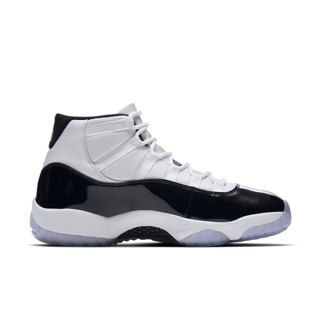 Jordan 11 Retro Concord (2018) sneaker in black and white with ice outsole, iconic design reminiscent of the 1995 original.