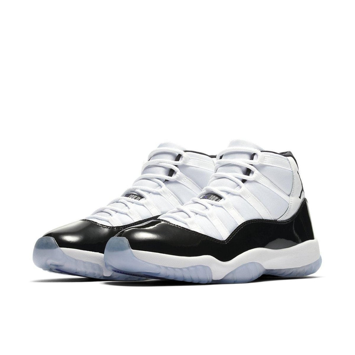 Jordan 11 Retro Concord (2018) sneakers in white and black with icy sole, reflecting vintage 1995 style and Michael Jordan's legacy.