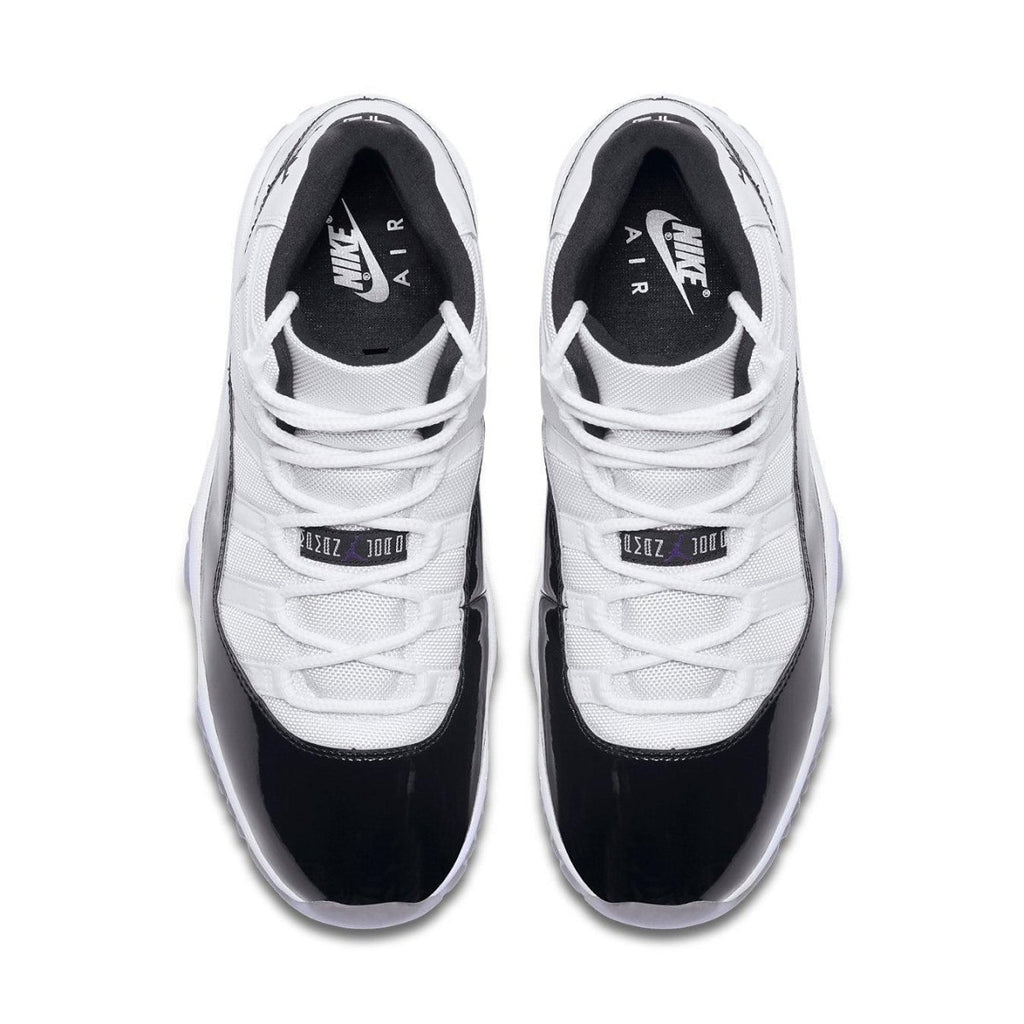 Jordan 11 Retro Concord 2018 sneakers featuring a black and white colorway with patent leather finish.