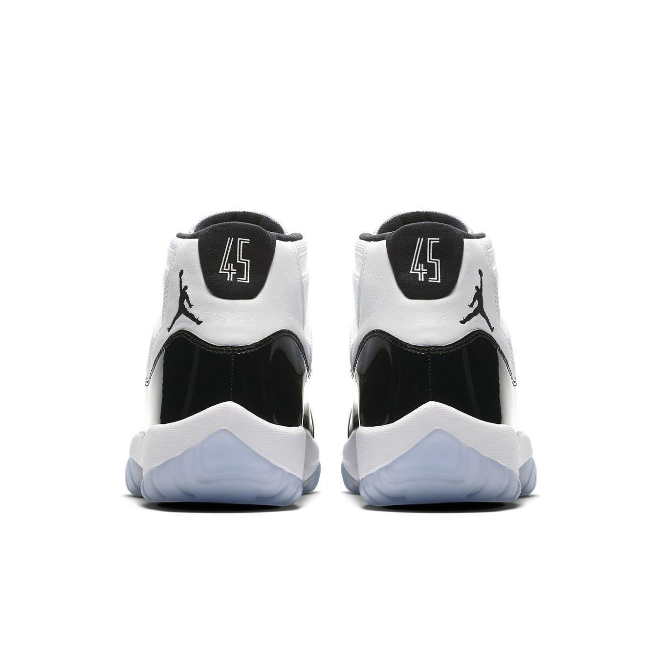 Jordan 11 Retro Concord 2018 sneakers, featuring classic black and white design with '45' heel details.