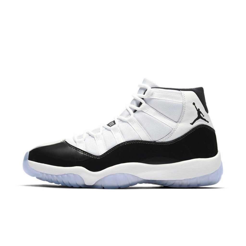 Jordan 11 Retro Concord (2018) sneaker in black and white with icy sole and classic design.
