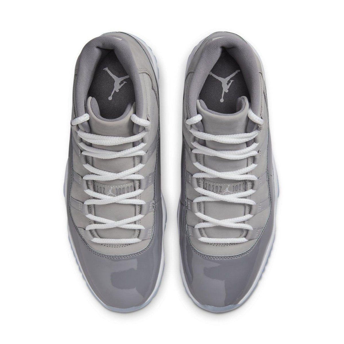 Top view of Air Jordan 11 Retro Cool Grey 2021 sneakers with sleek nubuck and glossy patent leather.