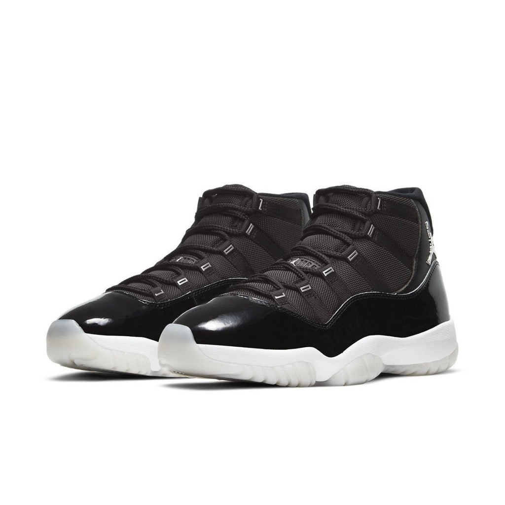 Air Jordan 11 Retro Jubilee 25th Anniversary in all-black with reflective details and white outsole.
