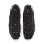 Top view of Air Jordan 11 Retro Jubilee 25th Anniversary sneakers in black with glossy detailing and Jordan logo.