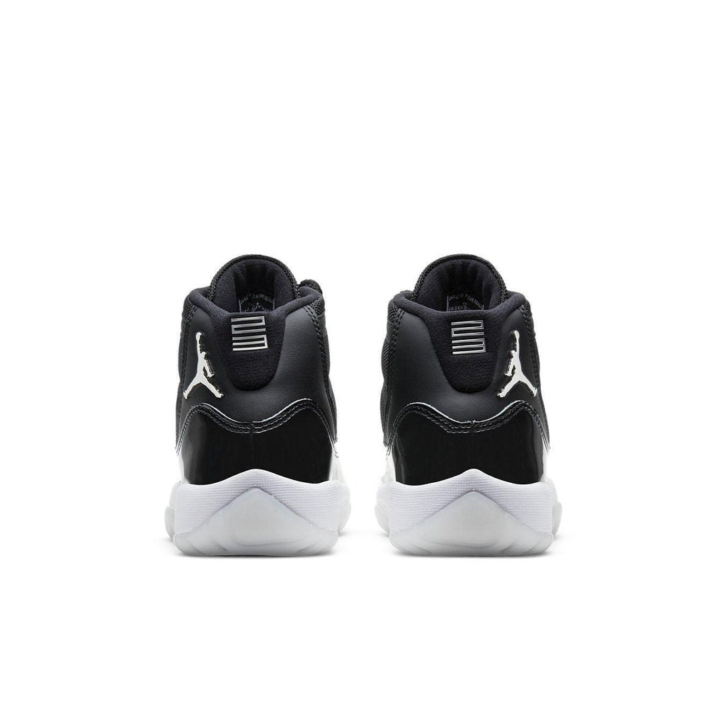 Retro Jordan 11 Jubilee (GS) shoes, featuring a sleek black and white design from the back.
