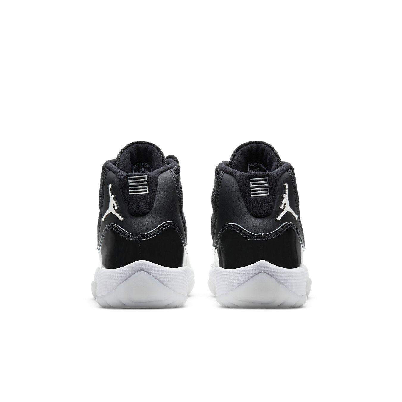 Retro Jordan 11 Jubilee (GS) shoes, featuring a sleek black and white design from the back.