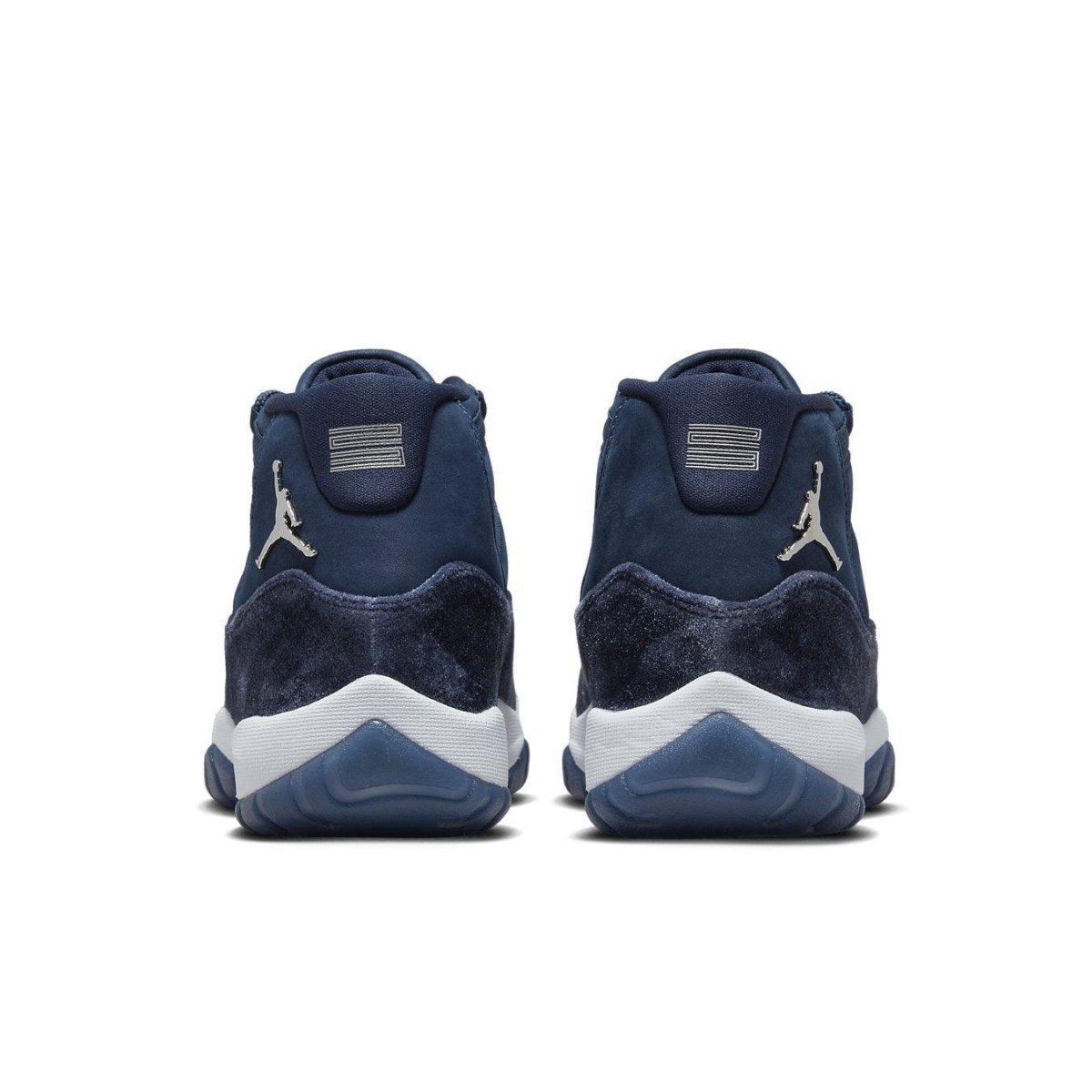 Rear view of women's Jordan 11 Retro Midnight Navy shoes showcasing premium suede and rubber outsole.
