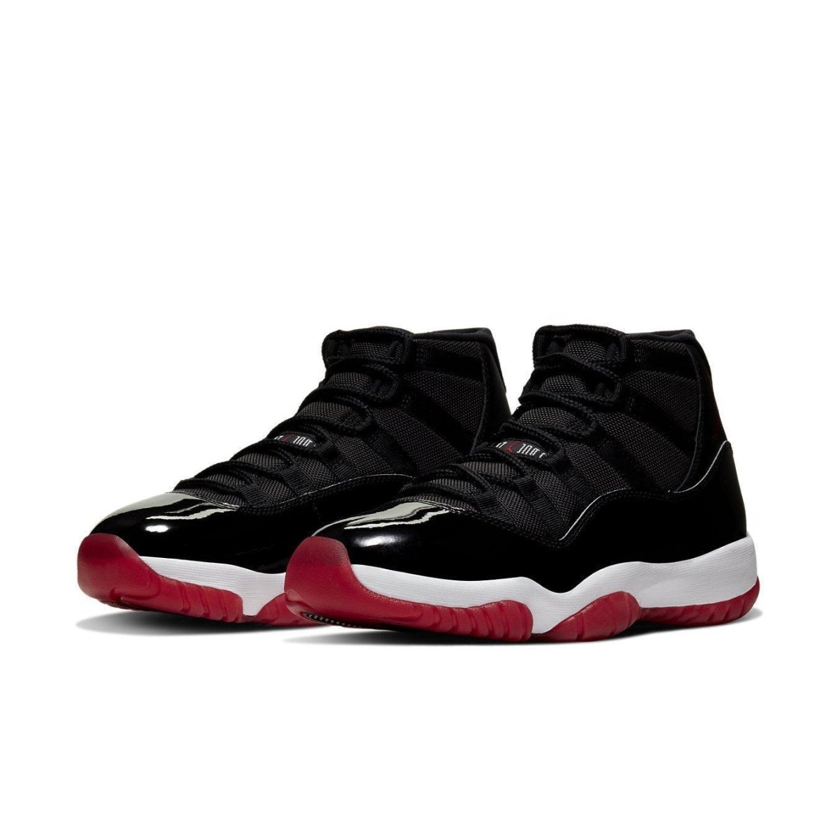 Air Jordan 11 Retro 'Bred' 2019 sneakers featuring black mesh, patent leather, and a Varsity Red outsole.
