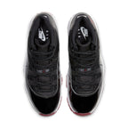 Air Jordan 11 Retro Bred 2019 top view showcasing black mesh and patent leather design with Varsity Red accents.