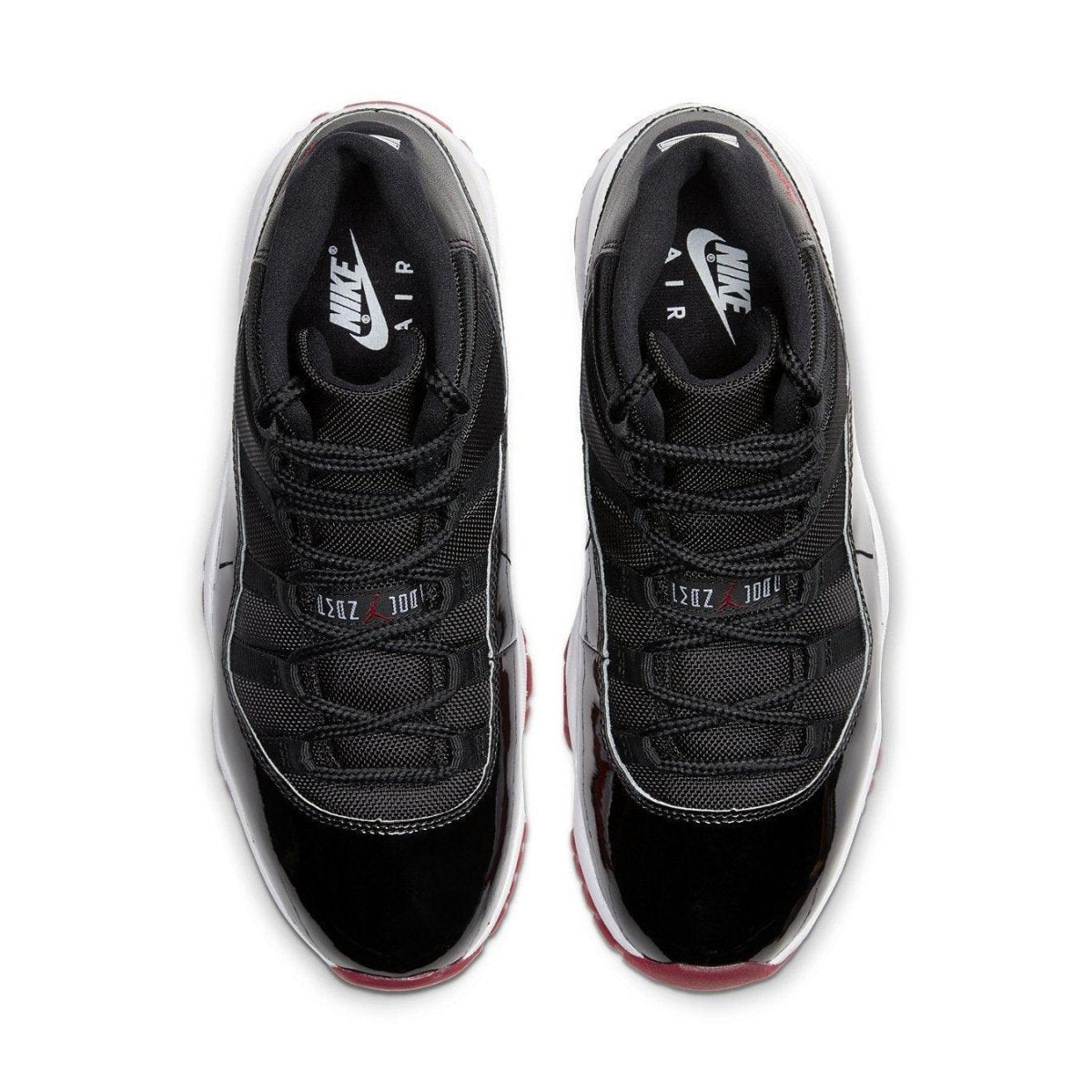 Air Jordan 11 Retro Bred 2019 top view showcasing black mesh and patent leather design with Varsity Red accents.