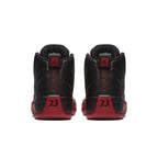 Rear view of the Air Jordan 12 Retro 'Flu Game' 2016 with black and red colorway, featuring iconic 23.