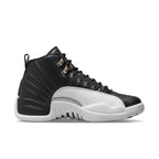 Air Jordan 12 Retro Playoffs 2022 sneaker in black and white leather with silver details.