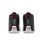 Rear view of Air Jordan 12 Retro Playoffs 2022 sneakers showcasing black leather and red accents.