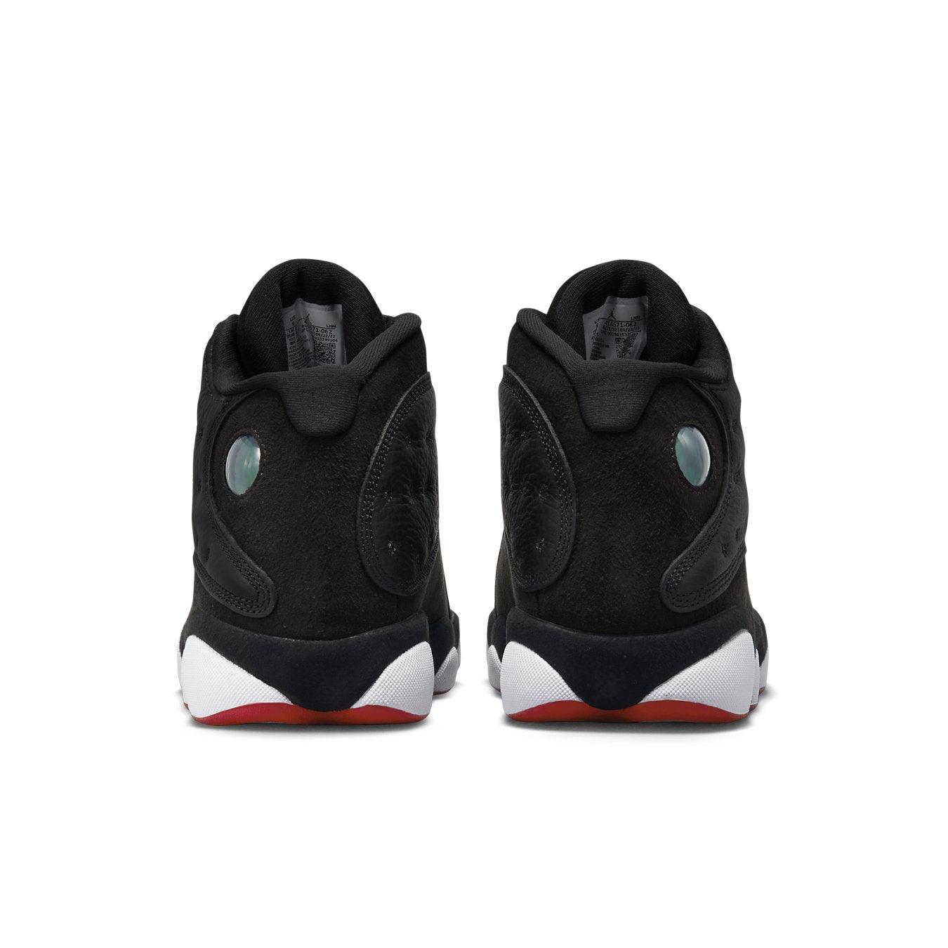 Back view of the Jordan 13 Retro Playoffs 2023 featuring black suede and leather upper with ologram detail.