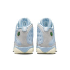 Rear view of Jordan 13 Retro SoleFly sneakers with light blue and gray colorway and iconic holographic detailing.