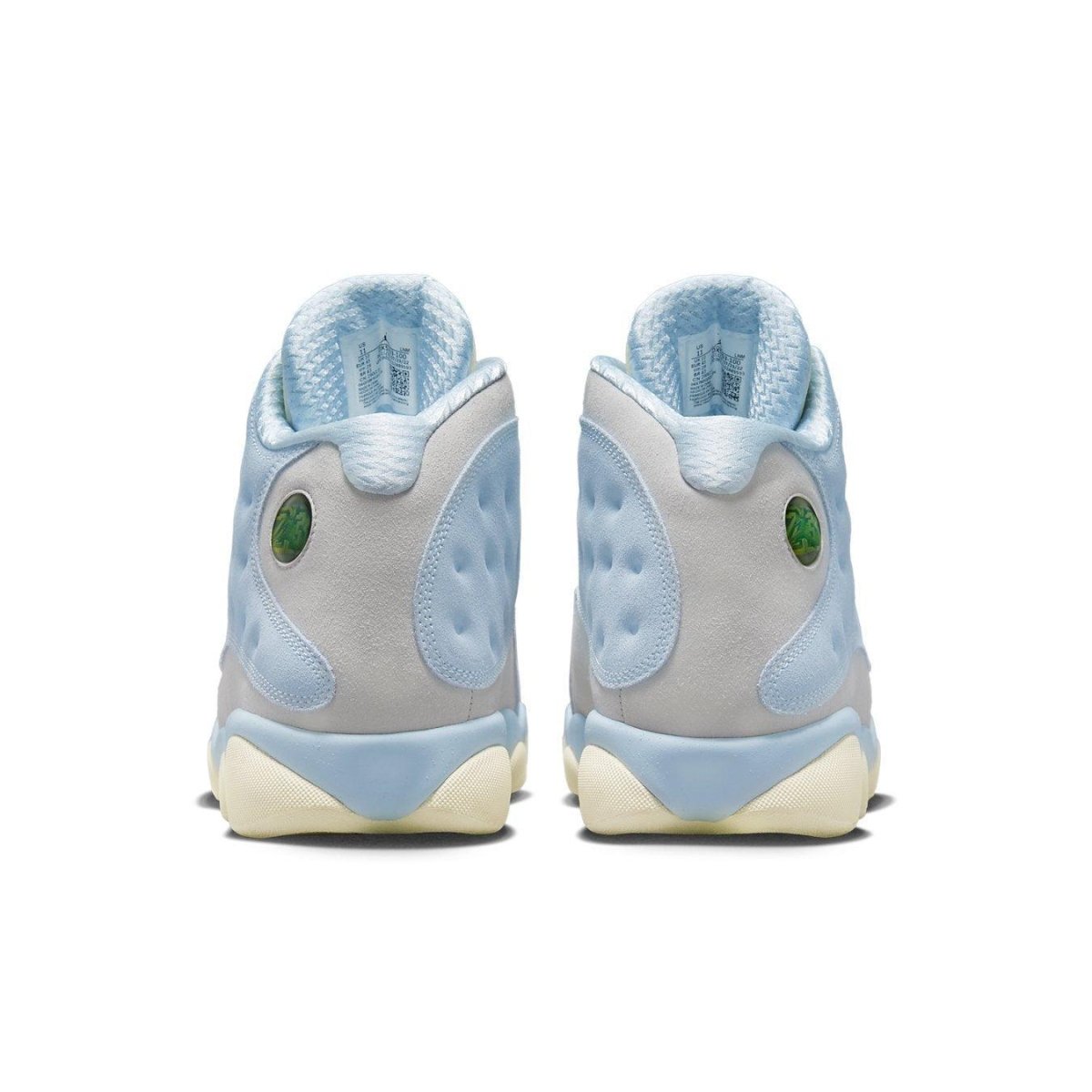 Rear view of Jordan 13 Retro SoleFly sneakers with light blue and gray colorway and iconic holographic detailing.